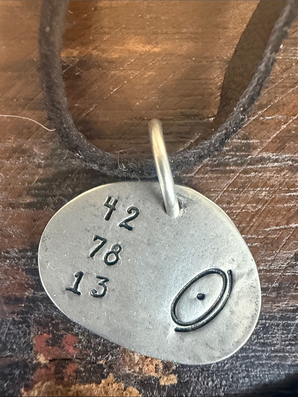 “Meaning of Life” Jes MaHarry unisex silver leather cord sliding knot necklace.